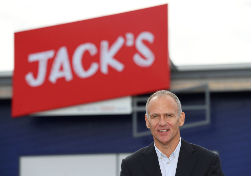 © Reuters. Dave Lewis, Chief Executive Officer of Tesco stands outside on of Tesco's new discount supermarkets called Jack's, in Chatteris