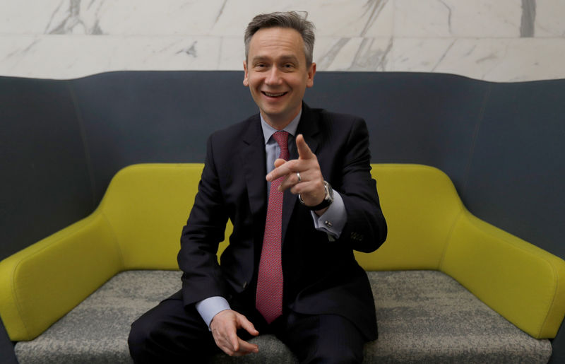 © Reuters. FILE PHOTO: Rio Tinto CEO Jean-Sebastien Jacques reacts as he poses for a photograph prior to the company releasing its 2017 full year results, in London