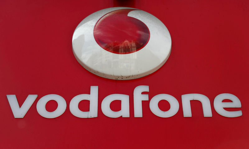 © Reuters. FILE PHOTO: A branded sign is displayed on a Vodafone store in London