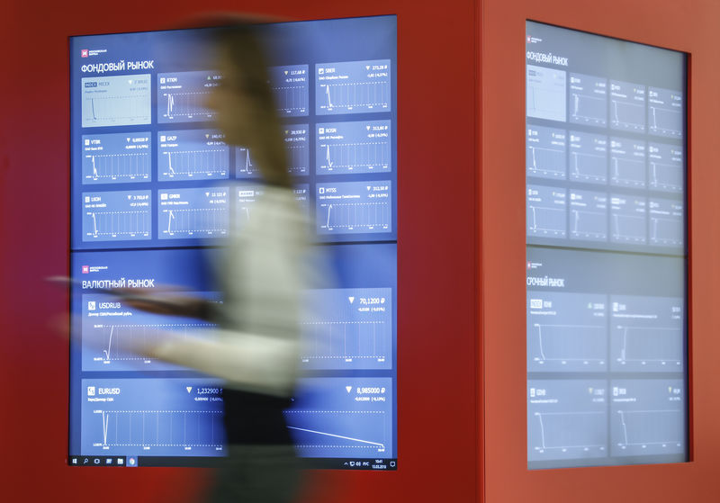 © Reuters. A view shows information screens at Moscow Exchange