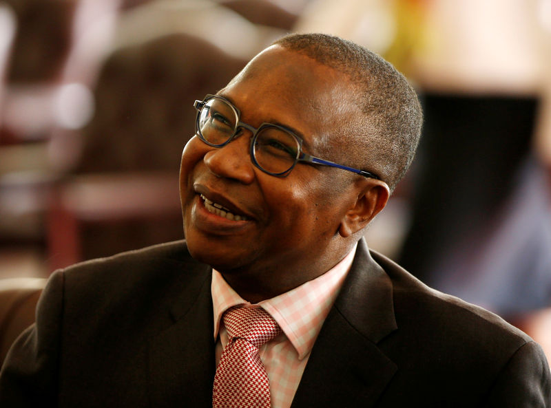 © Reuters. Zimbabwean Finance Minister Mthuli Ncube looks on during the swearing in of new cabinet ministers at State House in Harare