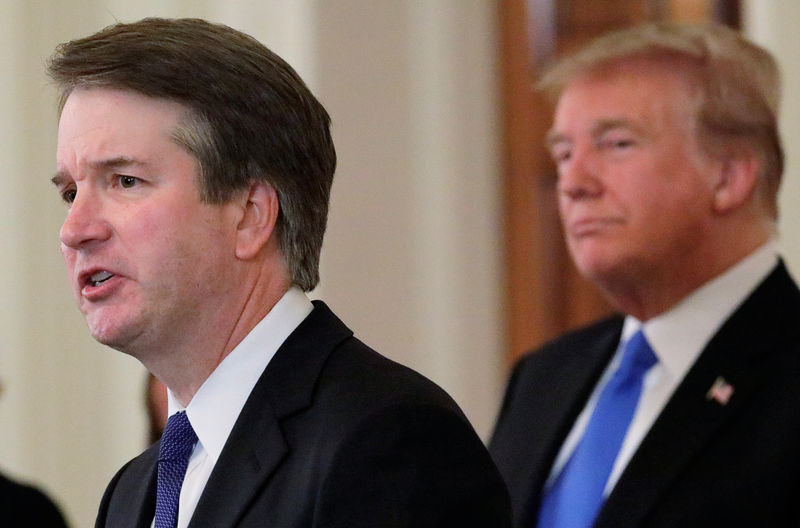© Reuters. President Trump listens to U.S. Supreme Court nominee Kavanaugh speak at his nomination announcement at the White House in Washington