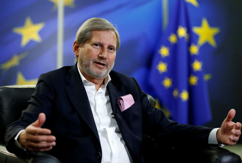 © Reuters. FILE PHOTO: European Neighbourhood Policy and Enlargement Negotiations Commissioner Johannes Hahn speaks during an interview with Reuters in Brussels