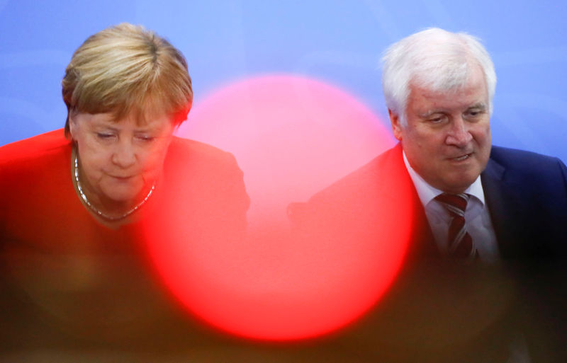 © Reuters. German Chancellor Angela Merkel and Interior Minister Horst Seehofer leave a news conference following the so called a housing summit on rising rents in many German cities and a general shortage of affordable housing in Berlin