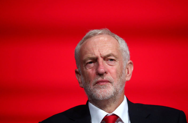 © Reuters. FILE PHOTO: Britain's Labour Party Leader Jeremy Corbyn sits on stage at the annual Labour Party Conference in Liverpool