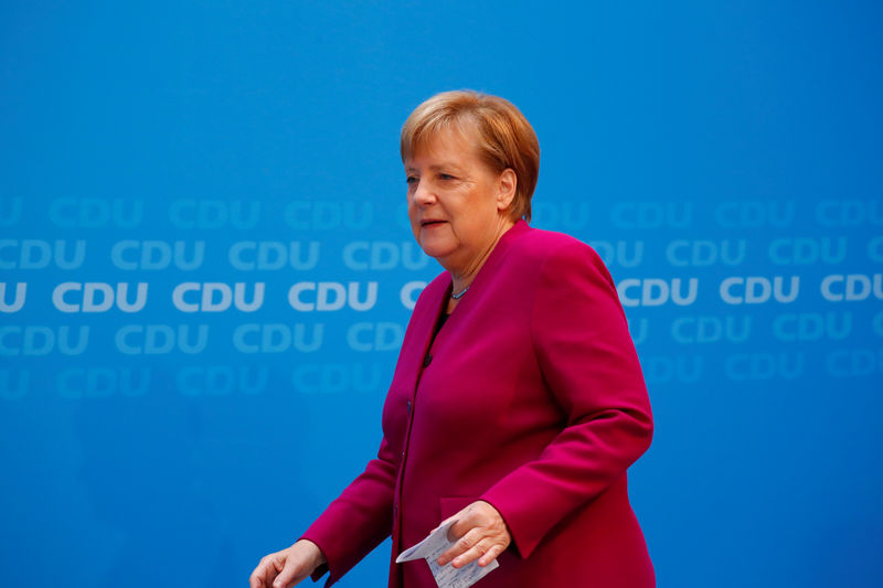 Â© Reuters. German Chancellor Angela Merkel arrives to give a statement at the CDU headquarters in Berlin