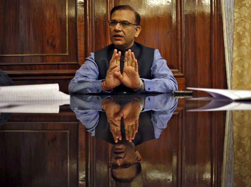 © Reuters. FILE PHOTO: Sinha gestures during an interview with Reuters in New Delhi