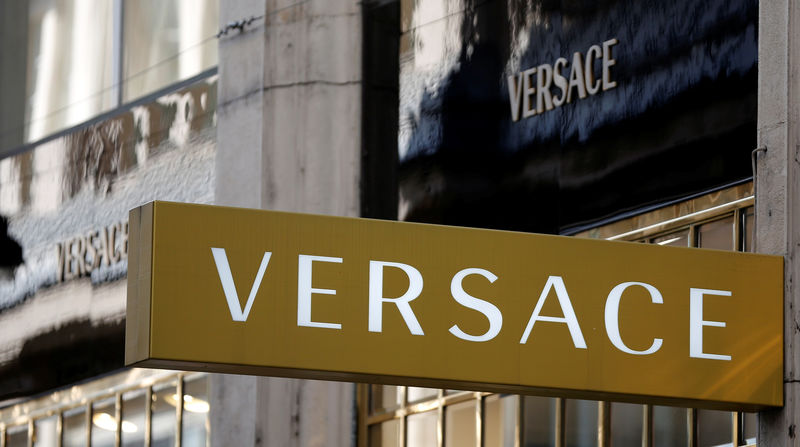 © Reuters. Company logos are pictured outside a Versace store in Vienna