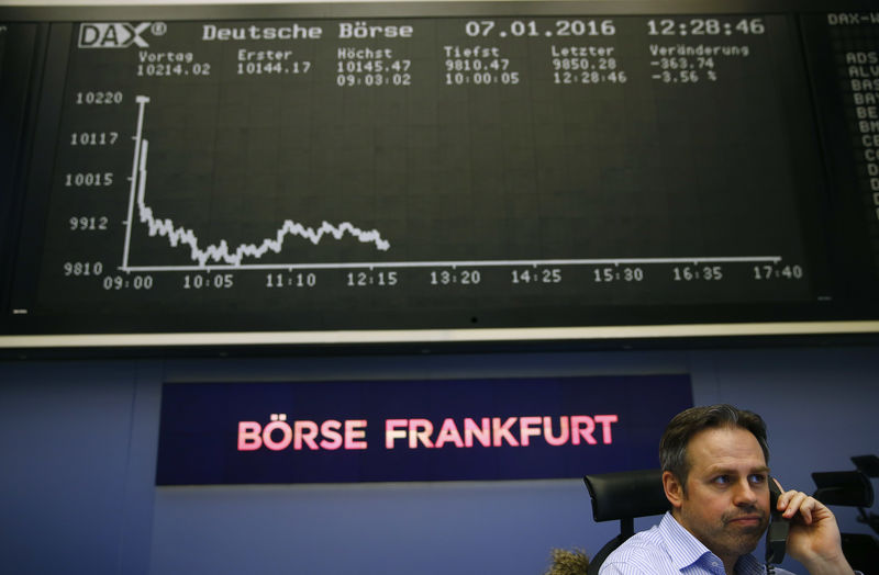 © Reuters. Trader speaks on phone in front of DAX board at Frankfurt's stock exchange
