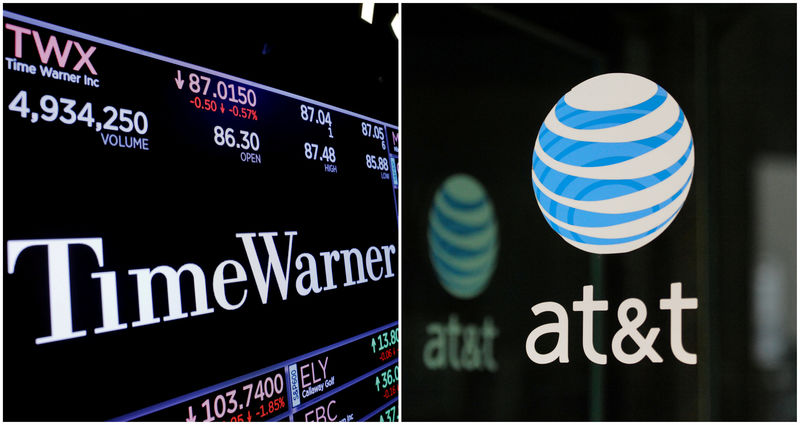 © Reuters. FILE PHOTO: A combination photo of the Time Warner shares price at the New York Stock Exchange and AT&T logo in New York