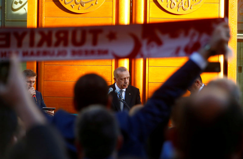 © Reuters. Turkish President Tayyip Erdogan delivers a speech as he attends the official inauguration of the Cologne Central Mosque in Cologne