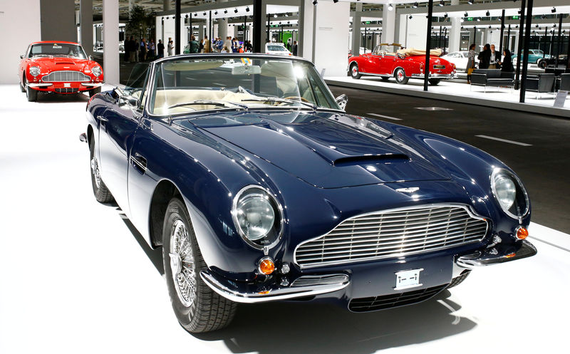 © Reuters. FILE PHOTO: Aston Martin DB6 Volante convertible sports car is displayed in front of a Aston Martin DB6 coupe during Grand Basel autoshow in Basel