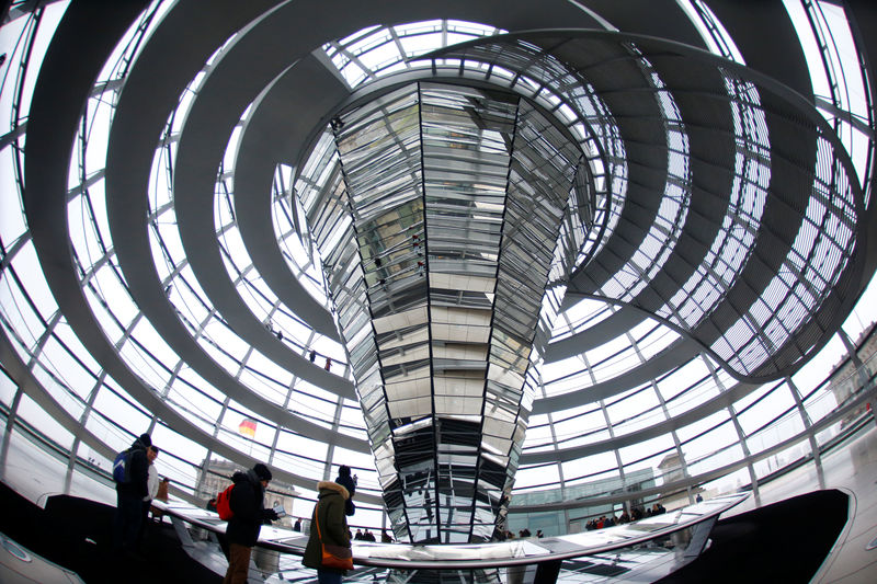 © Reuters. Visitors walk inside the glass dome of the Reichstag building