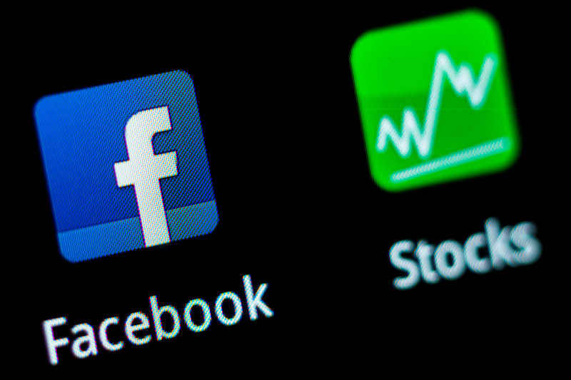 © Reuters. FILE PHOTO: A Facebook application logo is pictured on a mobile phone in this photo illustration taken in Lavigny