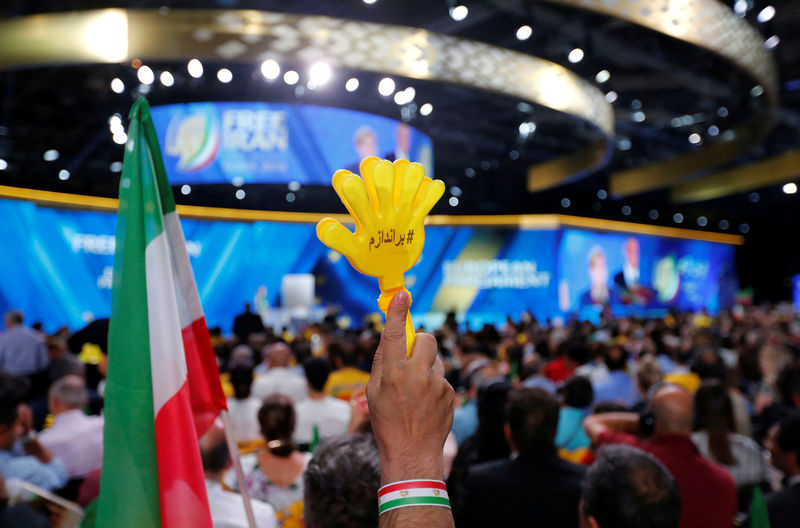 © Reuters. FILE PHOTO: Supporters of Maryam Rajavi, president-elect of the National Council of Resistance of Iran (NCRI), attend a rally in Villepinte, near Paris