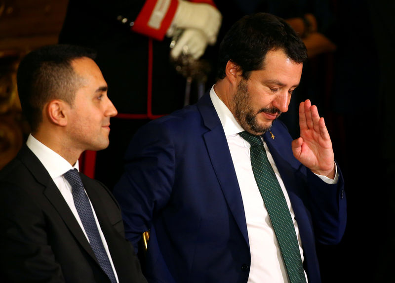 © Reuters. FILE PHOTO: FILE PHOTO: Interior Minister Matteo Salvini gestures next to Italy's Minister of Labor and Industry Luigi Di Maio at the Quirinal palace in Rome