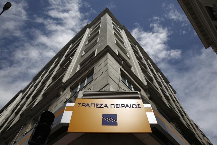 © Reuters. FILE PHOTO:  The logo of Piraeus Bank is seen outside a branch in Athens