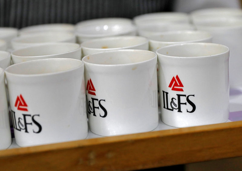 © Reuters. Logo of IL&FS is seen printed on mugs at its headquarters in Mumbai
