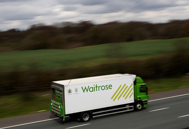 © Reuters. A Waitrose delivery vehicle drives along the M6 motorway near Knutsford, northern England.