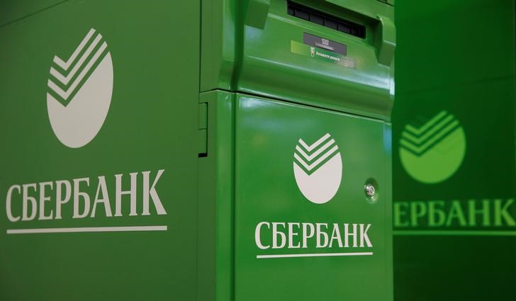 © Reuters. FILE PHOTO: Logos of Sberbank are seen on ATM machines at its branch in Moscow