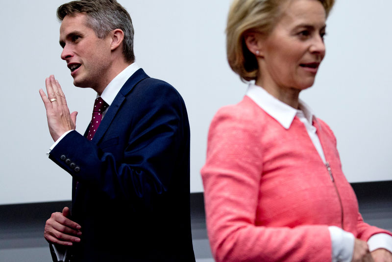 © Reuters. Britain's Defence Minister Williamson and German Defence Minister von der Leyen are seen during a NATO defence ministers meeting in Brussels