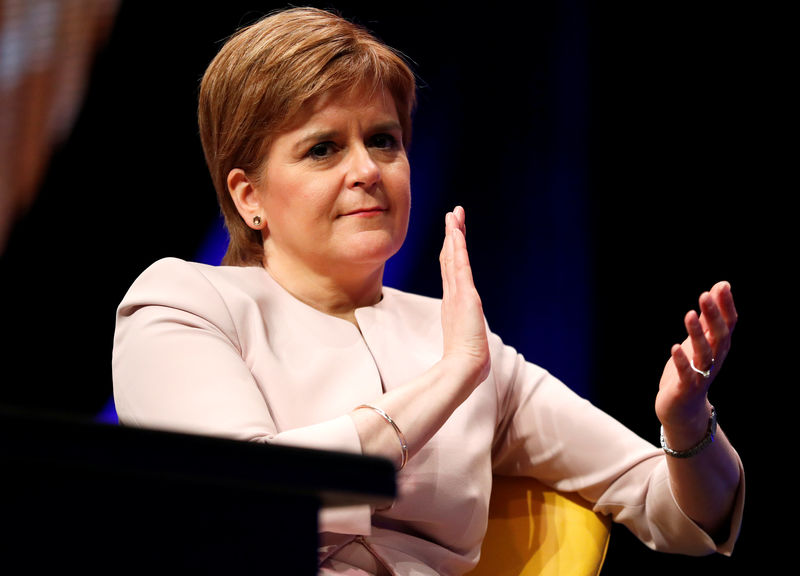 © Reuters. Scotland's First Minister Nicola Sturgeon listens to Plaid Cymru's leader Adam Price speak at the Scottish National Party's party's conference in Glasgow, Scotland