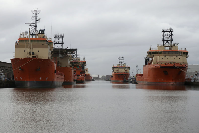 © Reuters. FILE PHOTO: Vessels that are used for towing oil rigs in the North Sea are moored up at William Wright docks in Hull