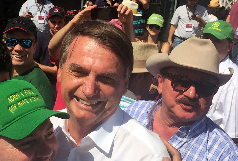 © Reuters. Nabhan Garcia ao lado de Bolsonaro em Ribeirão Preto