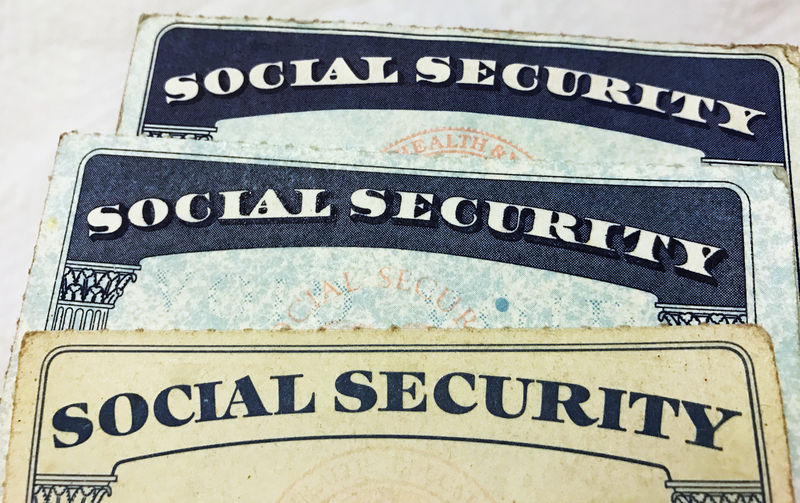 © Reuters. FILE PHOTO: U.S. Social Security card designs over the past several decades