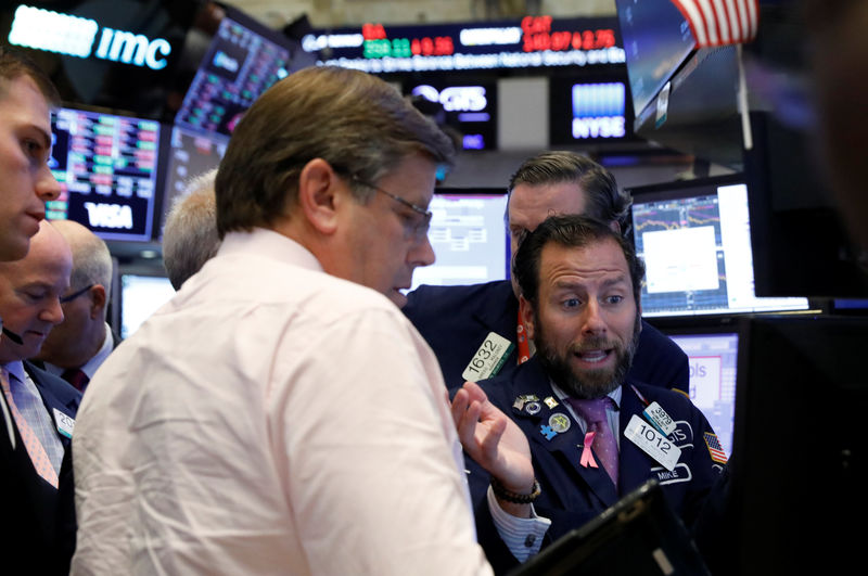 Wall St. extends slide with trade and rates in focus
