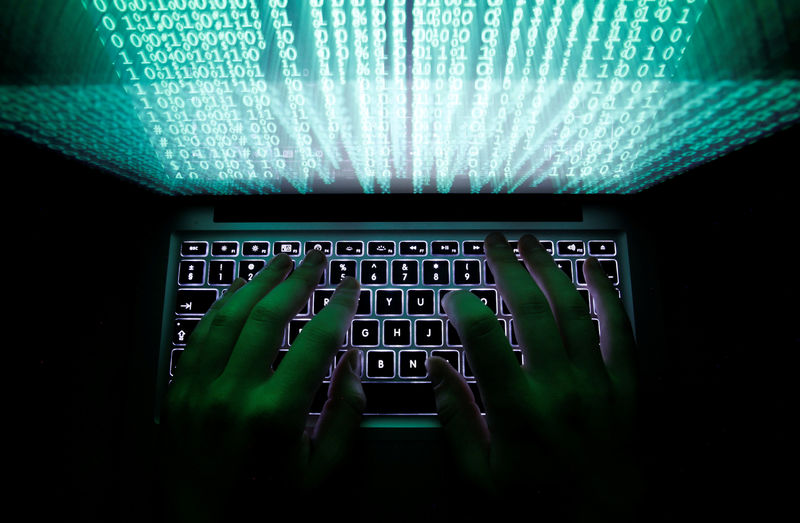 © Reuters. FILE PHOTO: Illustration file picture shows a man typing on a computer keyboard in Warsaw