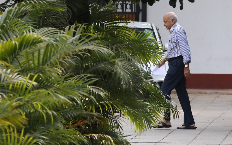 © Reuters. India's Minister of State for External Affairs Mobashar Jawed Akbar walks inside his residence in New Delhi