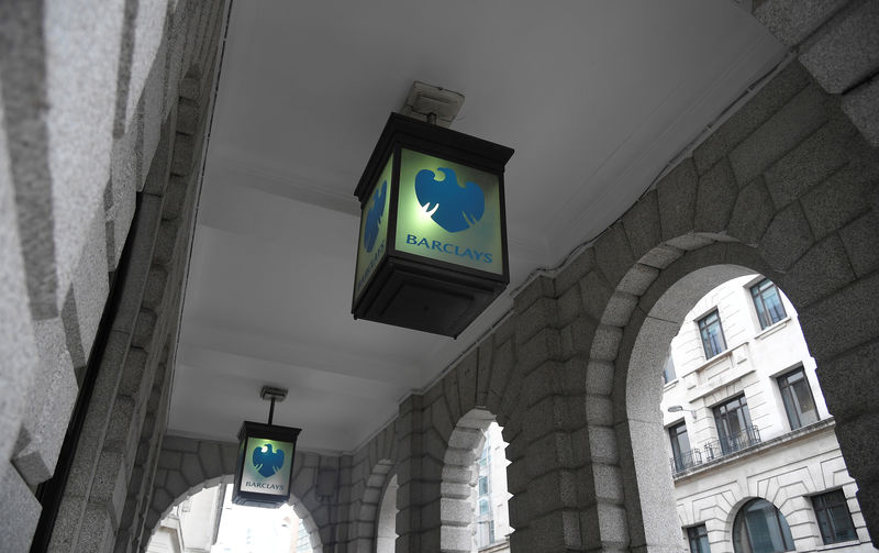 © Reuters. FILE PHOTO - The logo of Barclays bank is seen on glass lamps outside of a branch of the bank in the City of London financial district in London