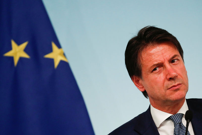 © Reuters. FILE PHOTO: Italy's Prime Minister Giuseppe Conte attends a news conference with Interior Minister Matteo Salvini after to approve a new decree of the measures on immigration and security at Chigi Palace in Rome