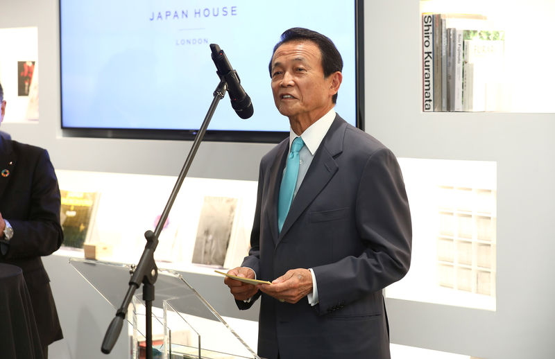 © Reuters. Taro Aso, Japan's Deputy Prime Minister, speaks at the official opening of Japan House in London