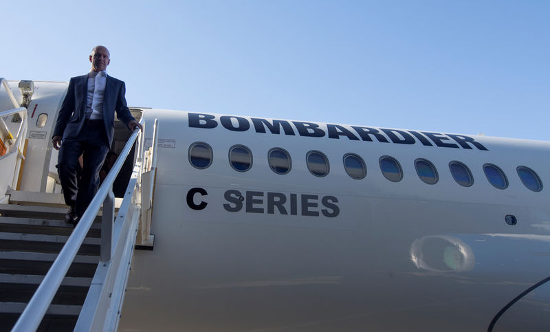 © Reuters. Alain Bellemare, president and chief executive officer of Bombardier Inc., walks off a C Series plane at Bombardier's plant in Mirabel