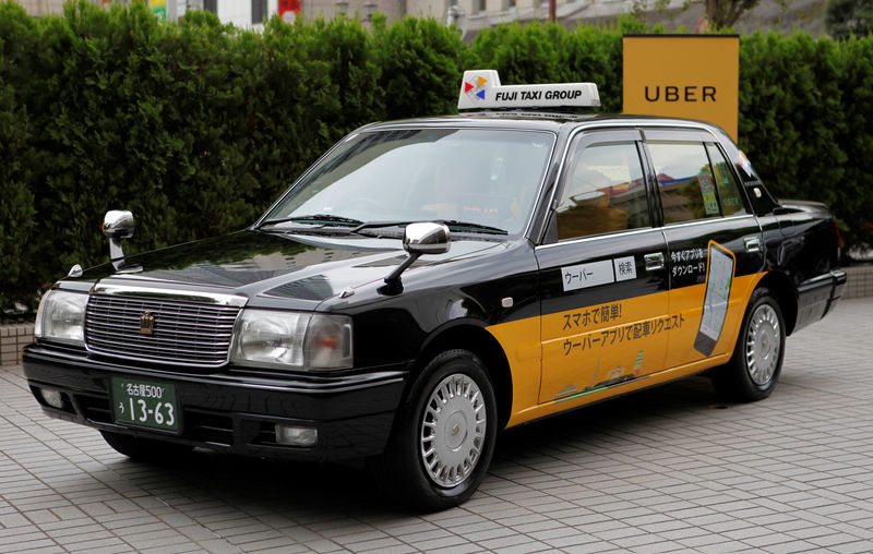 © Reuters. A taxi operated by Fuji Taxi Group bearing an Uber Japan ad is pictured in Nagoya