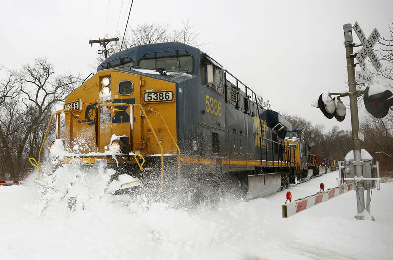 © Reuters. A CSX freight train blasts through high snow at a crossing in Silver Spring