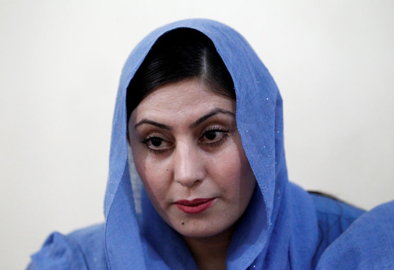 © Reuters. Candidate, Dewa Niazai, sits at her office during an election campaign in Jalalabad