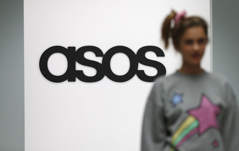 © Reuters. A model walks on an in-house catwalk at the ASOS headquarters in London