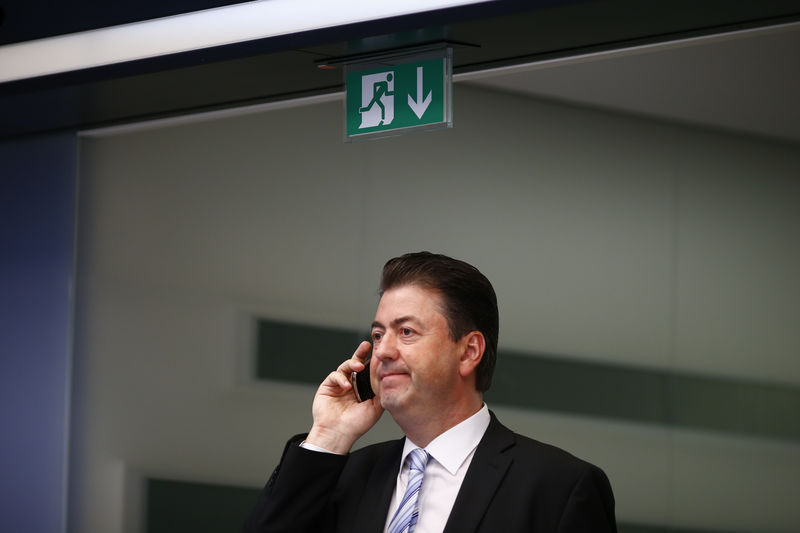 © Reuters. A trader speaks on the phone at the Frankfurt stock exchange