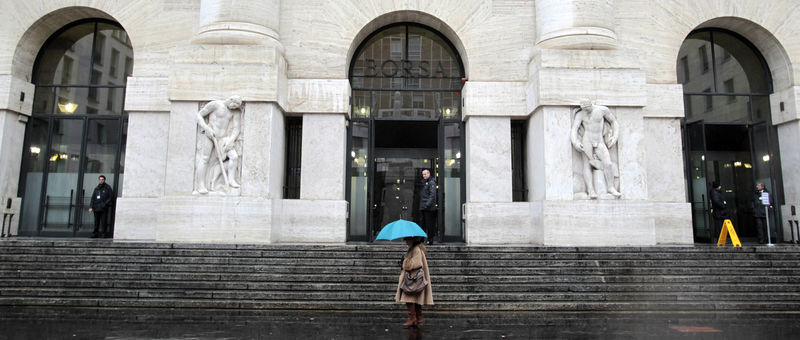 © Reuters. Woman walks past Milan's stock exchange building in downtown Milan