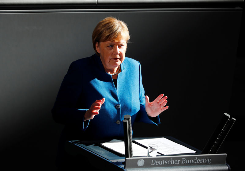 © Reuters. German Chancellor Merkel speaks during a session at the lower house of parliament Bundestag in Berlin