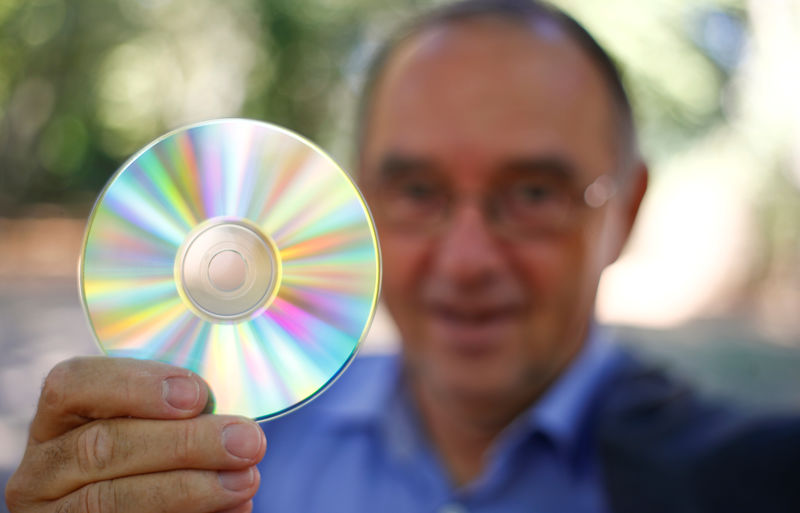 © Reuters. Former NRW finance minister Borjans holds a blank CD in Cologne