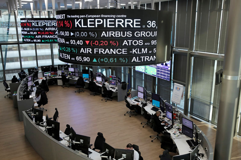 © Reuters. Company stock price information, including Klepierre SA, is displayed on screens as they hang above the Paris stock exchange, operated by Euronext NV, in La Defense business district in Paris