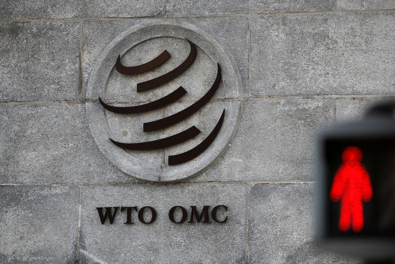 © Reuters. FILE PHOTO: The logo of the World Trade Organization (WTO) at its headquarters next to a red traffic light in Geneva