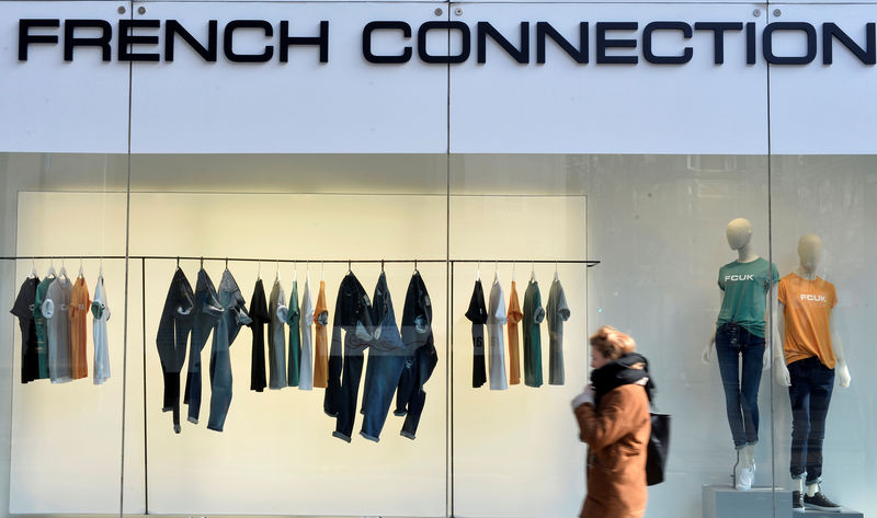 © Reuters. FILE PHOTO: A person walks past a French Connection store in London, Britain