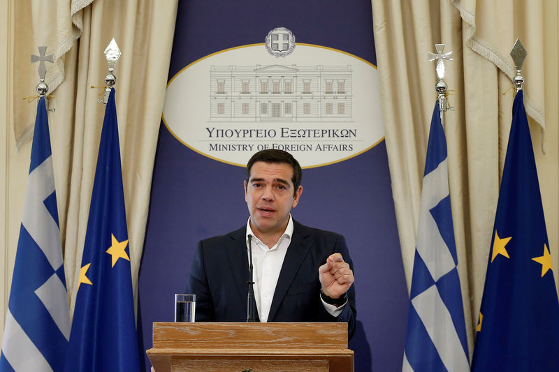 © Reuters. Newly appointed Greek Foreign Minister and Prime Minister Alexis Tsipras delivers a speech during a hand over ceremony at the Foreign Ministry, in Athens