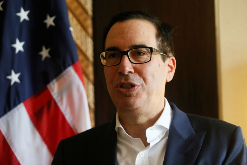 © Reuters. United States Secretary of the Treasury Steven Mnuchin speaks during an interview with Reuters at the International Monetary Fund - World Bank Annual Meeting 2018 in Nusa Dua