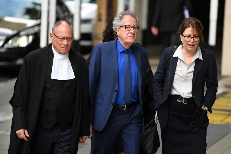 © Reuters. Australian actor Geoffrey Rush arrives at the Federal Court in Sydney